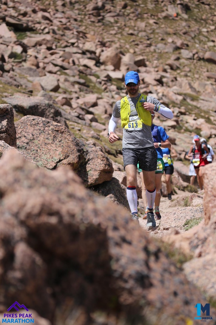 Brendan Ellis running through the rocky terrain of the Pikes Peak Marathon
